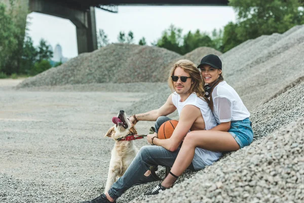 Young couple with dog — Stock Photo, Image