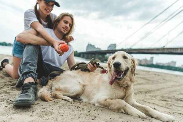 young couple with dog