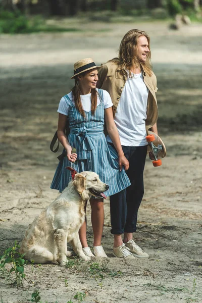 Young couple with dog — Stock Photo, Image