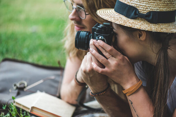 couple taking photos with vintage camera