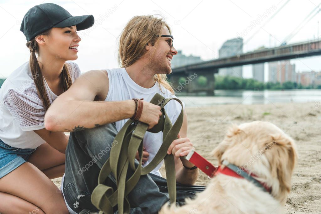 young couple with dog