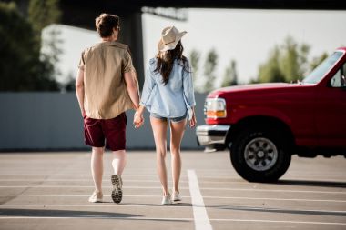 young couple walking  clipart