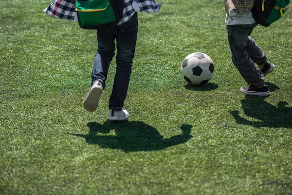 Schoolchildren playing soccer — Stock Photo, Image