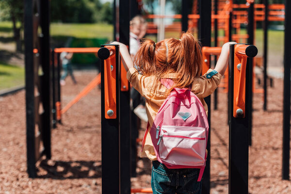 redhead child on playground