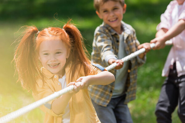 children playing tug of war