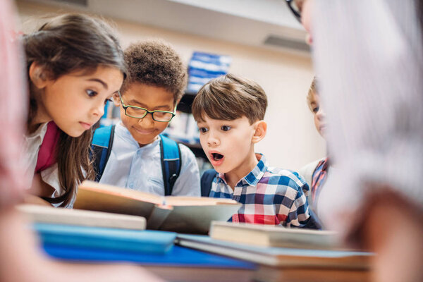 children looking at book