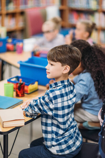 kids having lesson in library