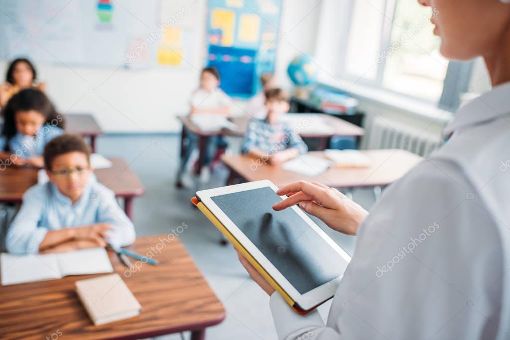teacher using digital tablet