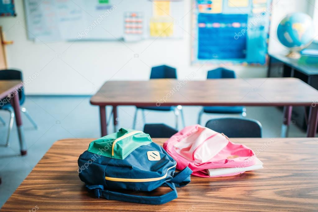 backpacks laying on desk