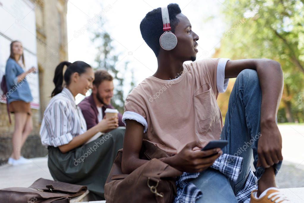 african american student in headphones