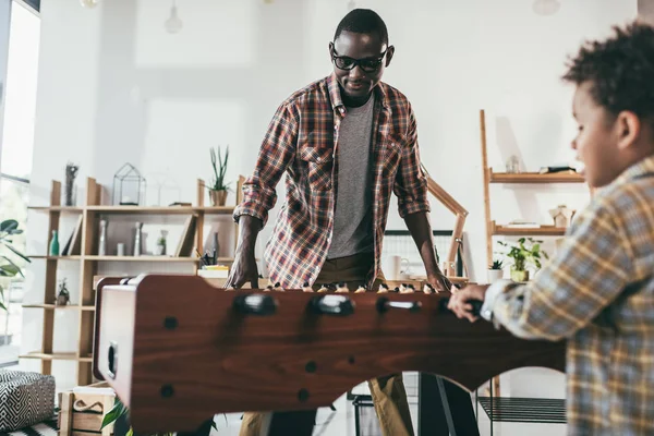 Father and son playing table football — Stock Photo, Image