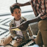 Father and son with digital tablet