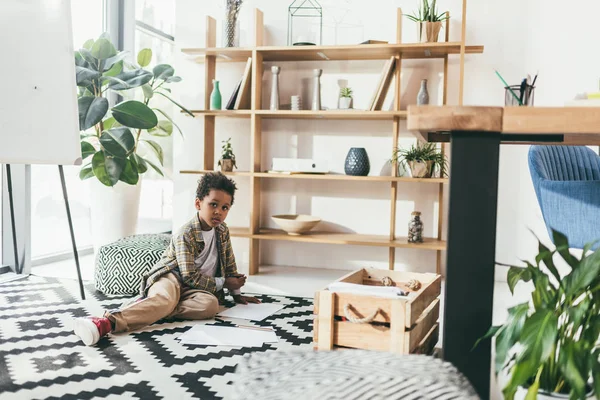 African american child drawing on floor — Stock Photo, Image