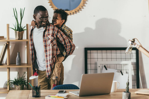 happy father and son in office