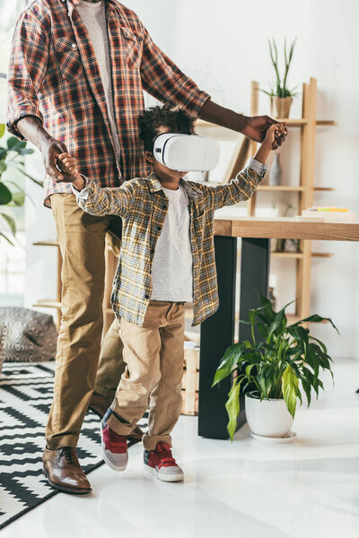 father and son with vr headset