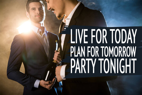 Стильные мужчины с бутылкой шампанского
