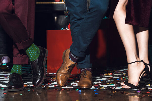 people standing on floor with confetti