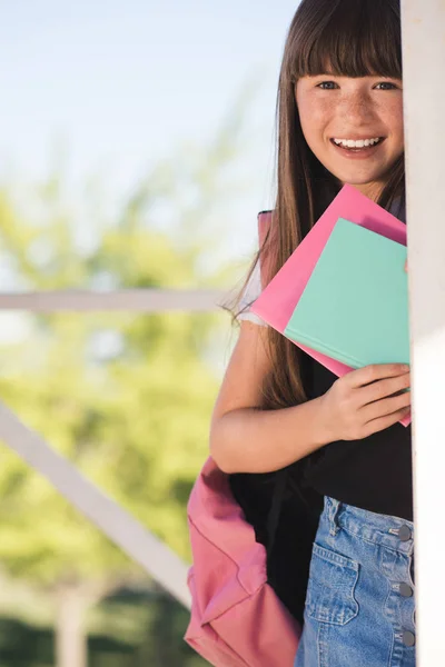 Smiling teenager with books — Stock Photo, Image