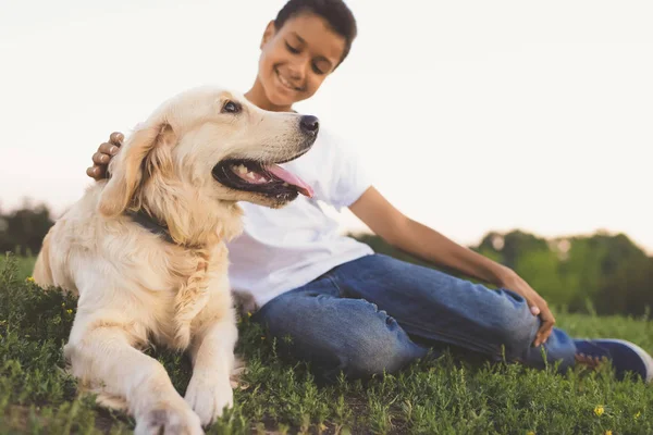 African american teenager with dog — Stock Photo, Image