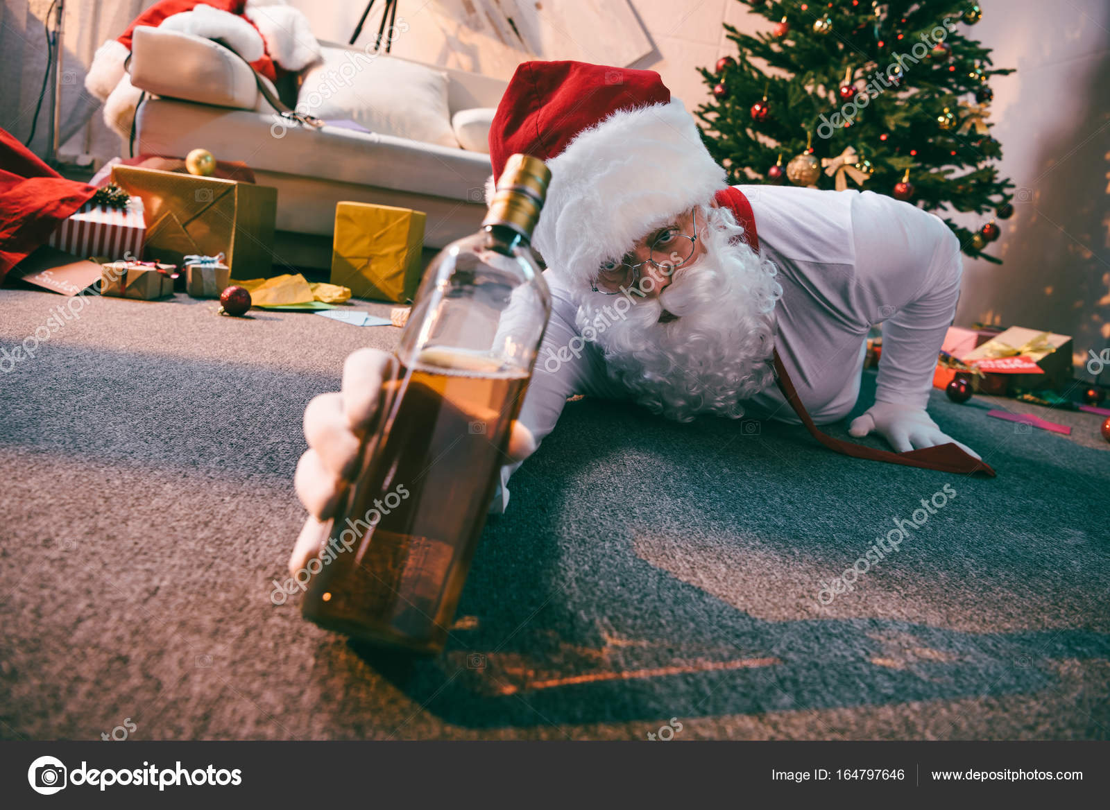 Santa claus with bottle of whiskey — Stock Photo © ArturVerkhovetskiy