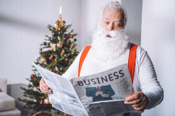 santa claus reading newspaper