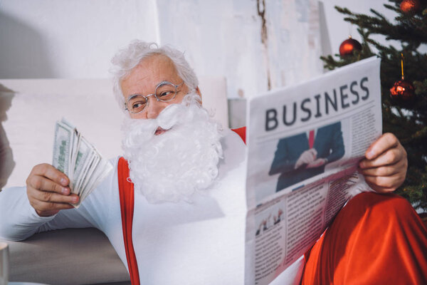 santa claus with cash in hand