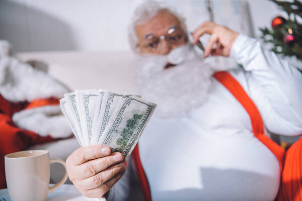 santa claus with cash in hand