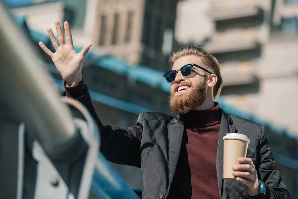 Man with disposable cup of coffee — Stock Photo, Image