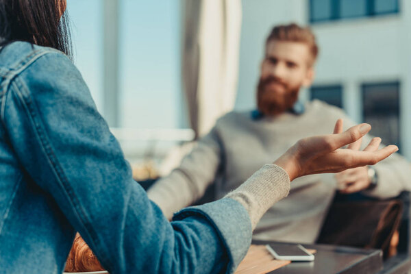 couple sitting outdoors in cafe