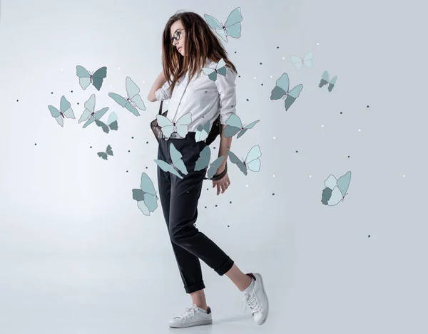 Stylish hipster woman with butterflies — Stock Photo, Image