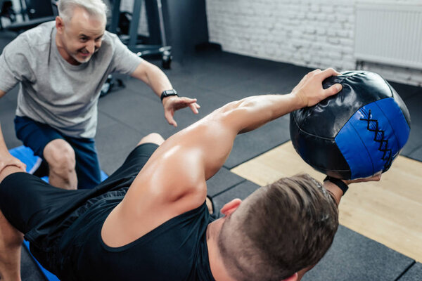 sportsman training with medicine ball