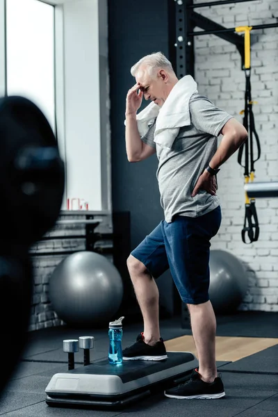 Exhausted senior sportsman — Stock Photo, Image