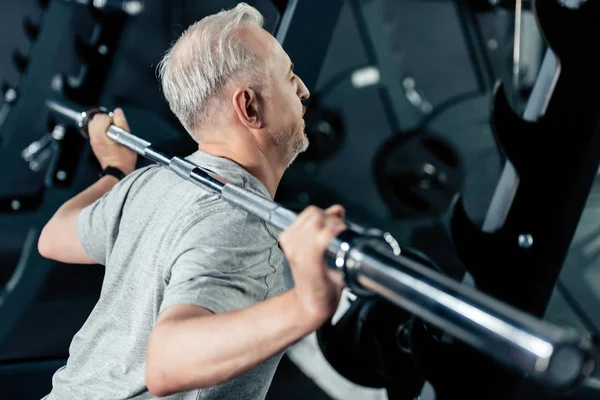 Sportsman training with barbell — Stock Photo, Image