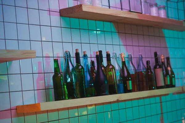 Various bottle on shelf in bar — Stock Photo, Image