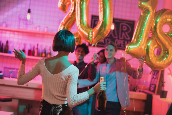 woman with bottle of champagne