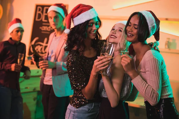 Multicultural women with glasses of champagne — Stock Photo, Image