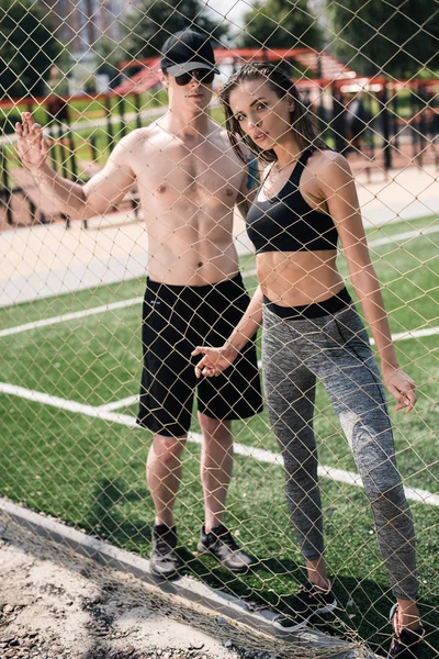 Man and woman on sports field — Free Stock Photo