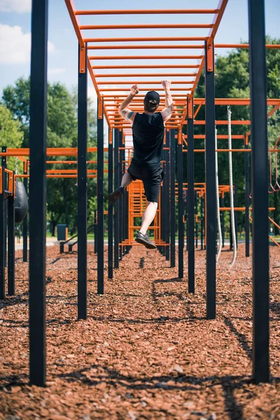 man exercising on sports ground