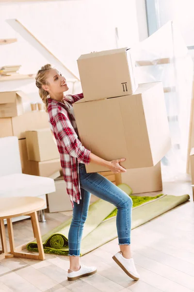 Girl with cardboard boxes — Stock Photo, Image