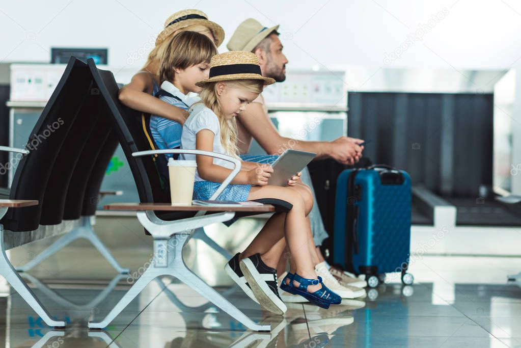 kid with tablet at airport