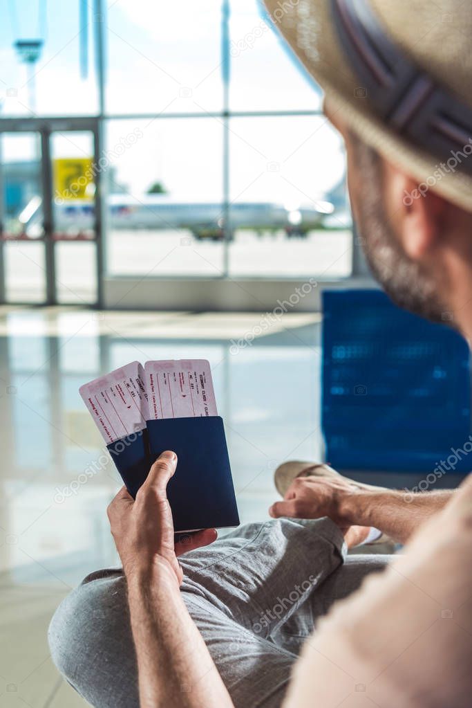 traveler with passports and tickets