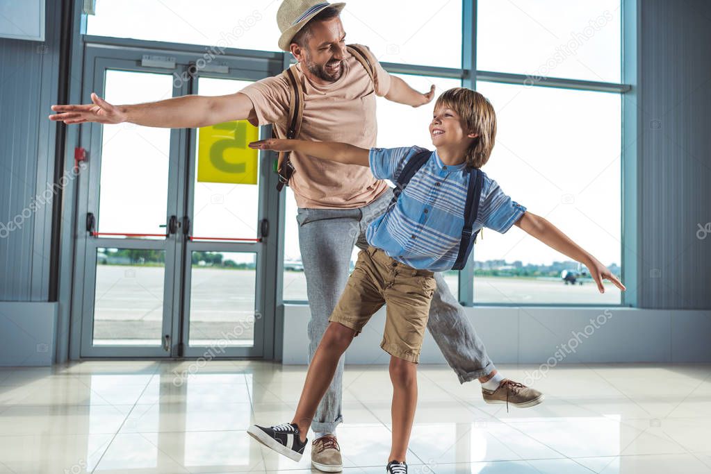 father and kid in airport