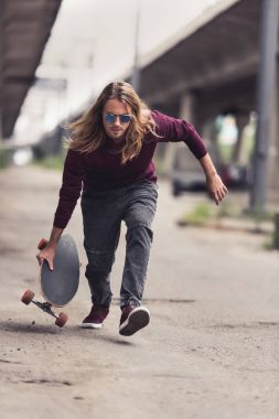 man riding skateboard clipart