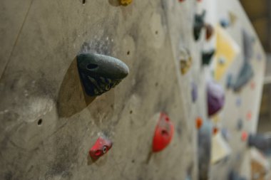 Grips on climbing wall clipart