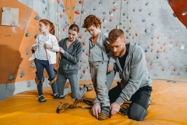 Parent securing children in harnesses — Stock Photo, Image