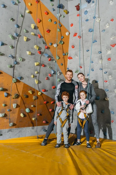 Family standing near climbing walls