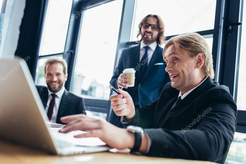 businessmen using laptop