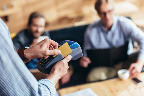 Person using payment terminal