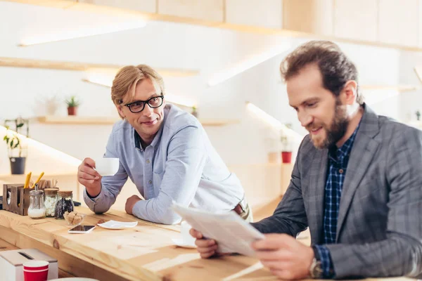 Middle aged businessmen in cafe — Stock Photo, Image