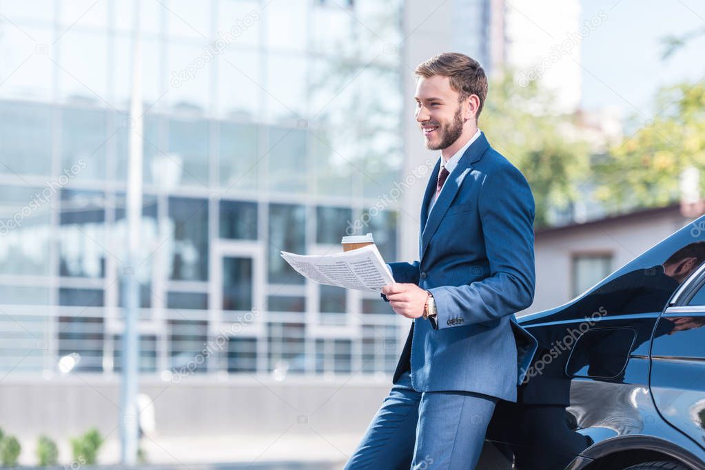 businessman with coffee and newspaper 